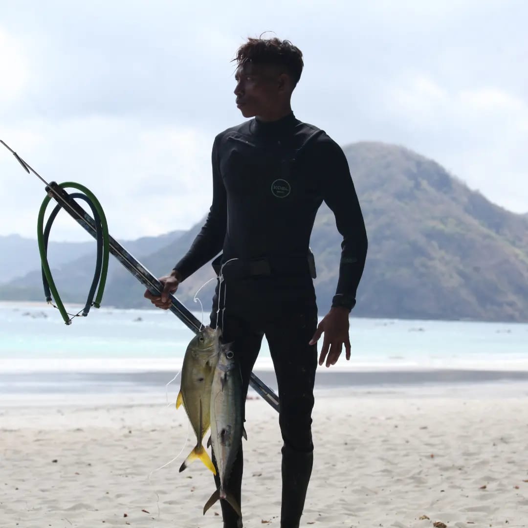 Kasjarod with his spearfishing catch in Lombok
